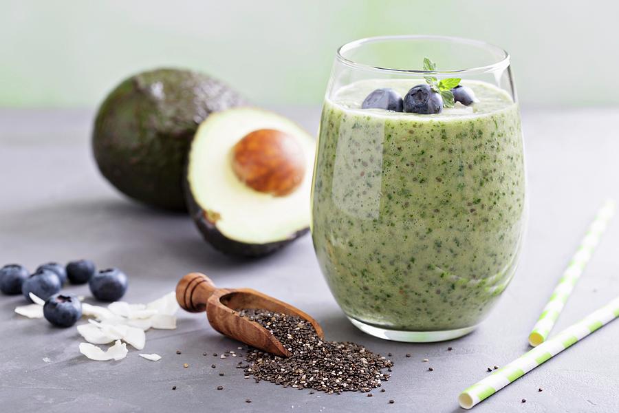 Green Avocado And Spinach Smoothie With Blueberries And Chia Seeds Photograph by Elena Veselova