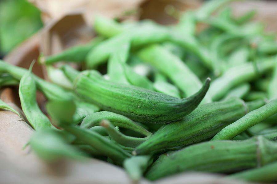 Still Life Photograph - Green Beans And Okra In A Paper Bag by Rene Comet