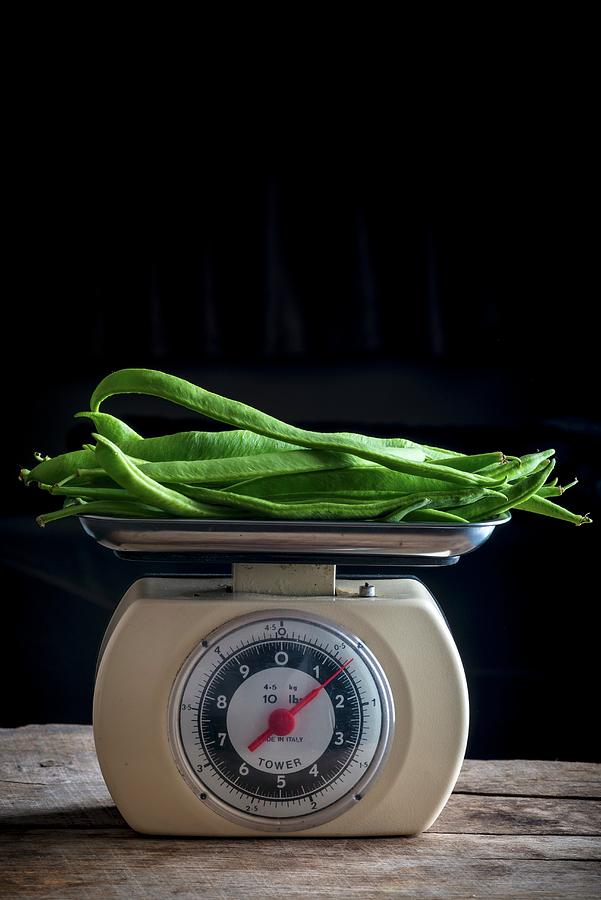 Green Beans On A Pair Of Old Kitchen Scales Photograph by Nitin Kapoor
