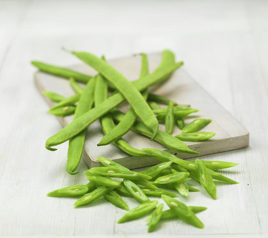 Green Beans, Some Chopped, On A Chopping Board Photograph by Hugh Johnson