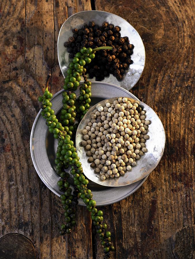 Green, Black And White Peppercorns seen From Above Photograph by Jalag / Julia Hoersch