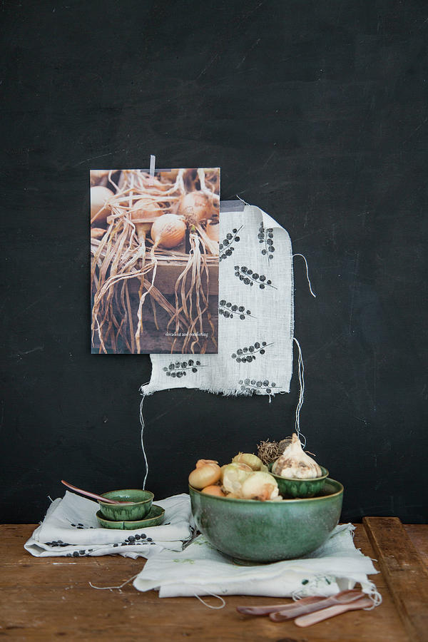 Green Bowl Of Onions And Garlic On Printed Cloth Photograph by Syl Loves