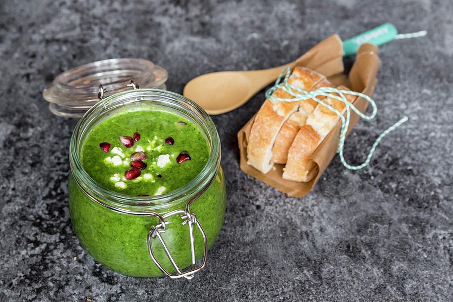 Green Cabbage Soup In A Glass Jar With Pomegranate Seeds And Feta Cubes Photograph by Sandra Rsch