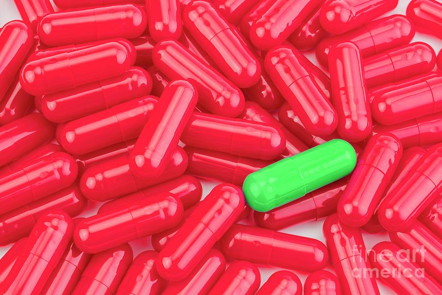 Green Capsule Among Red Pills Photograph by Digicomphoto/science Photo Library