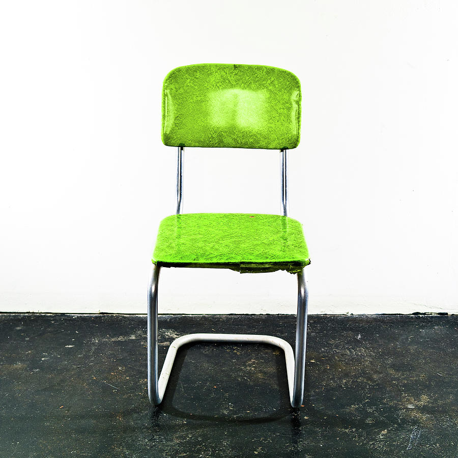 Green Chair On A Black Floor Photograph by Jay B Sauceda
