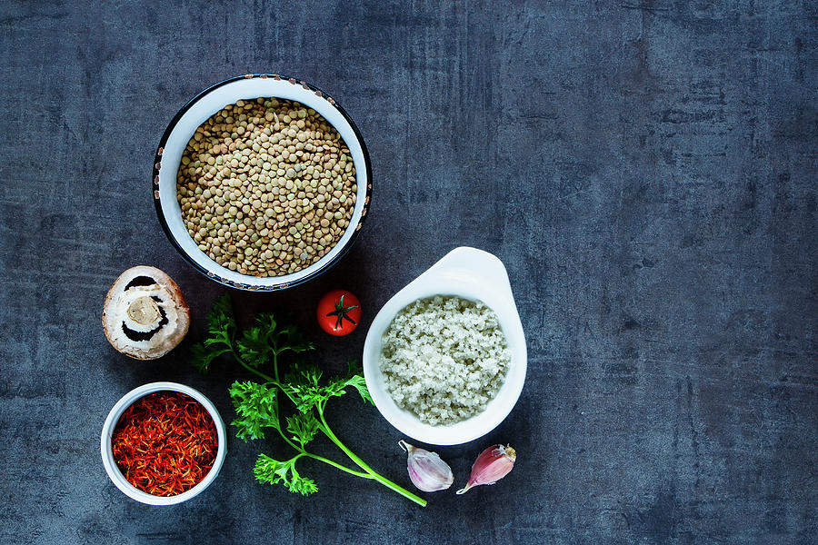 Green Lentils With Various Colorful Spices And Vegetables On Dark Grunge Table Photograph by Yuliya Gontar