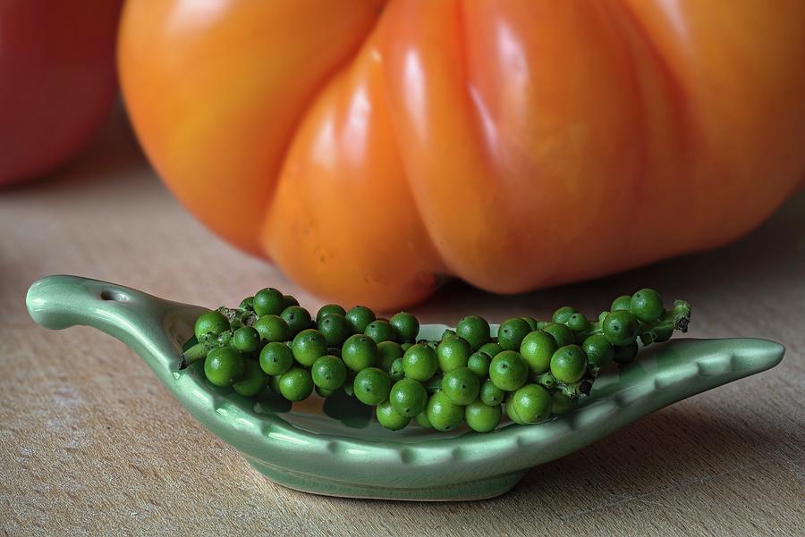 Green Peppercorns And A Pineapple Tomato Photograph by Dr. Martin Baumgrtner
