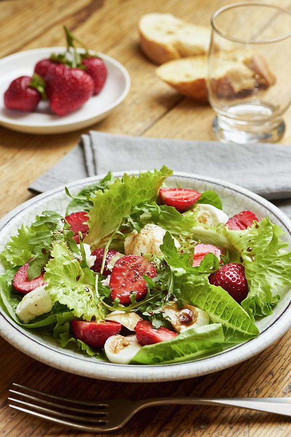 Green Salad With Strawberries, Rocket And Mozzarella Photograph by Ulrike Emmert