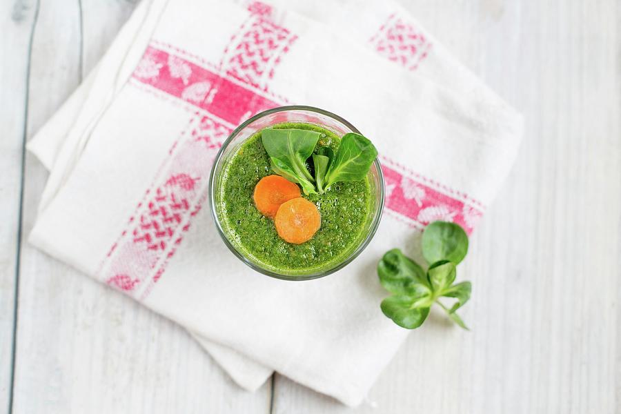 Green Smoothie With Carrots And Lambs Lettuce Photograph by Claudia Timmann