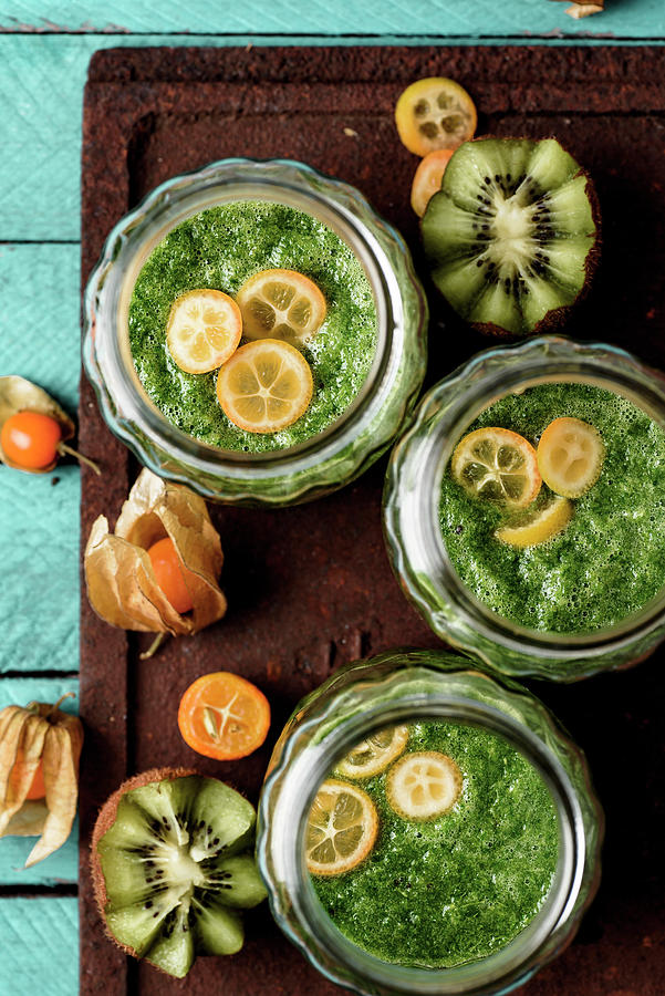 Green Smoothie With Spinach, Kiwi, Spirulina And Kumquat Photograph by Mateusz Siuta