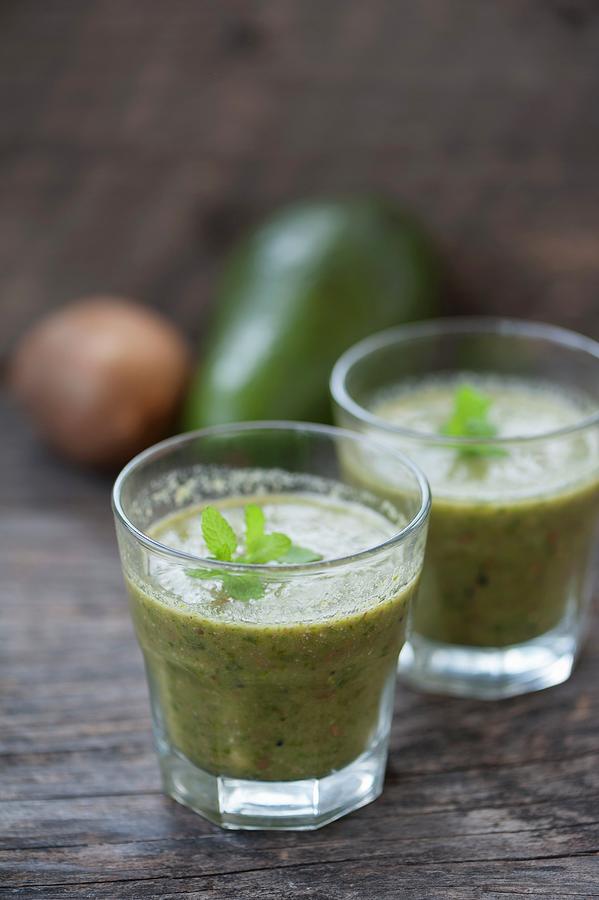 Green Smoothies Made With Kiwi, Avocado And Parsley Photograph by Gabriela Lupu