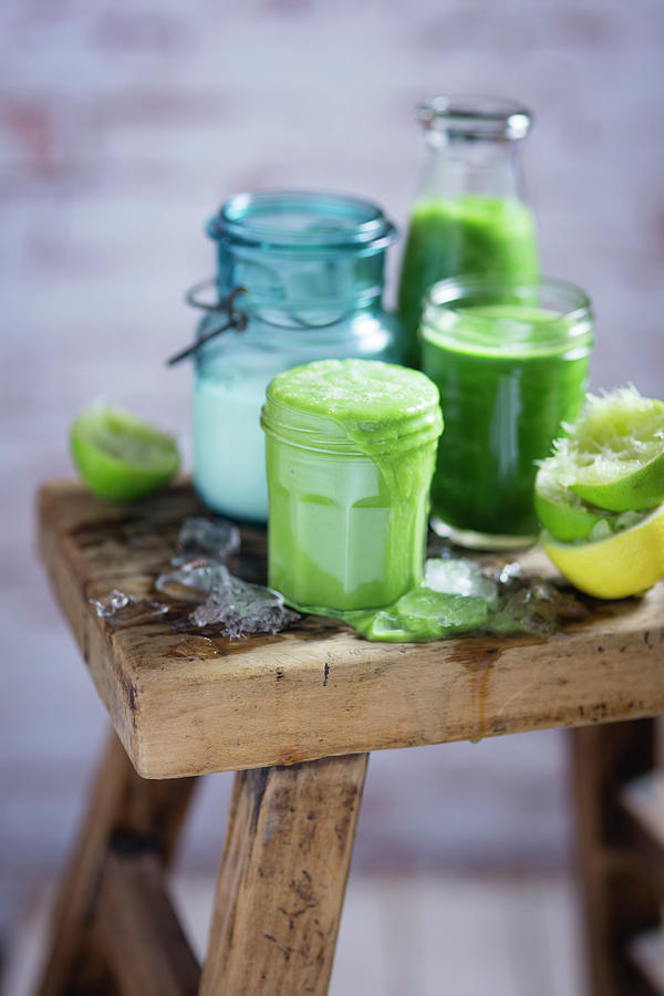Green Smoothies With Ingredients On A Wooden Stool Photograph by Eising Studio
