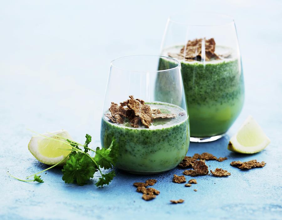 Green Smoothies With Parsley And Wholemeal Cornflakes Photograph by Mikkel Adsbl