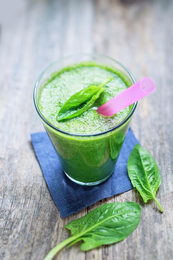 Green Spinach Smoothie With Banana And Mango Photograph by Brigitte Sporrer