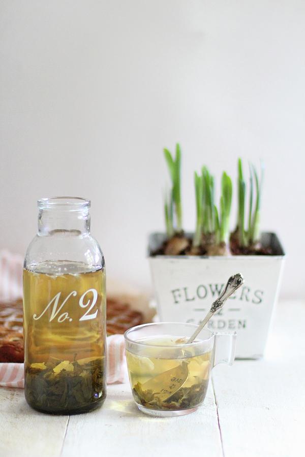 Green Tea In A Glass Bottle And In A Glass Photograph by Sylvia E.k Photography