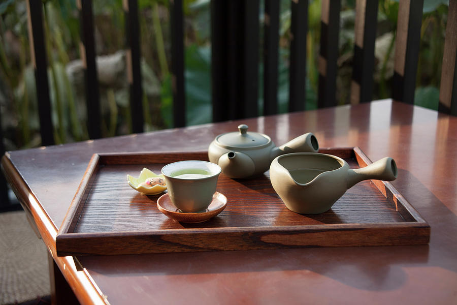 Green Tea Served Near A Lotus Pond Photograph by Martina Schindler