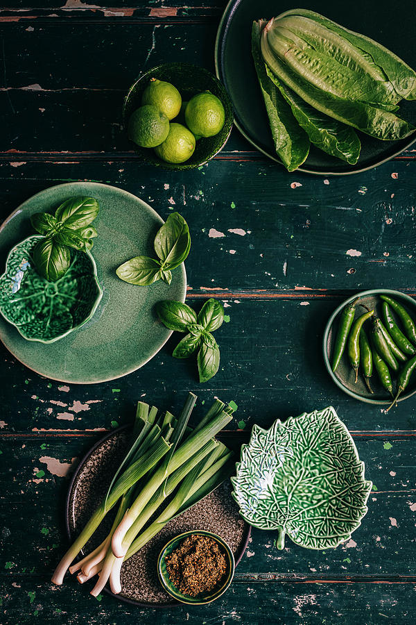 Green Veggies On Textured Green Wooden Surface Photograph by Hein Van Tonder