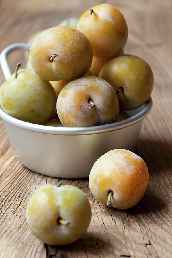 Greengages In An Aluminium Bowl Photograph by Hilde Mche