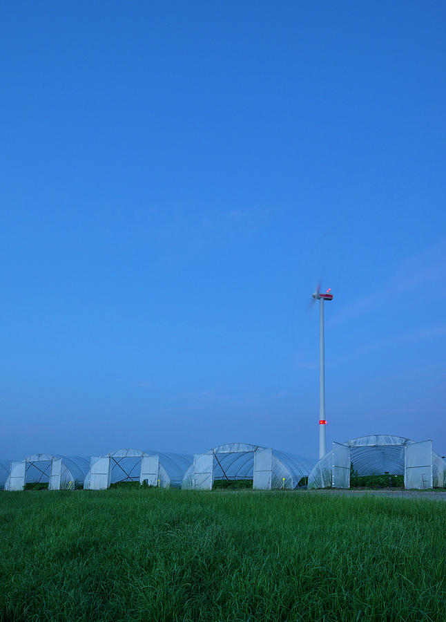 Nature Digital Art - Greenhouses And Spinning Wind Turbine At Night, Hoogstraten, Antwerpen, Belgium by Mischa Keijser