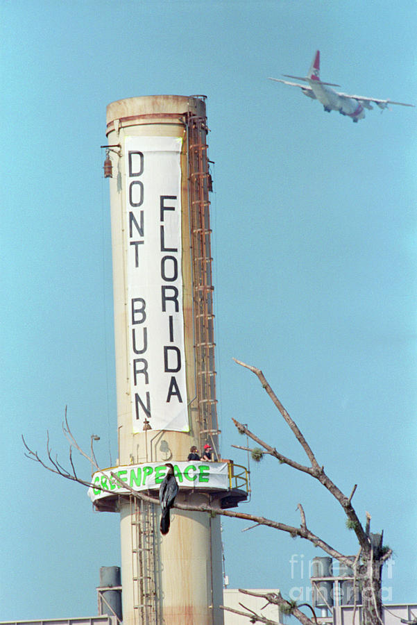 Greenpeace Banner On Smokestack Photograph by Bettmann