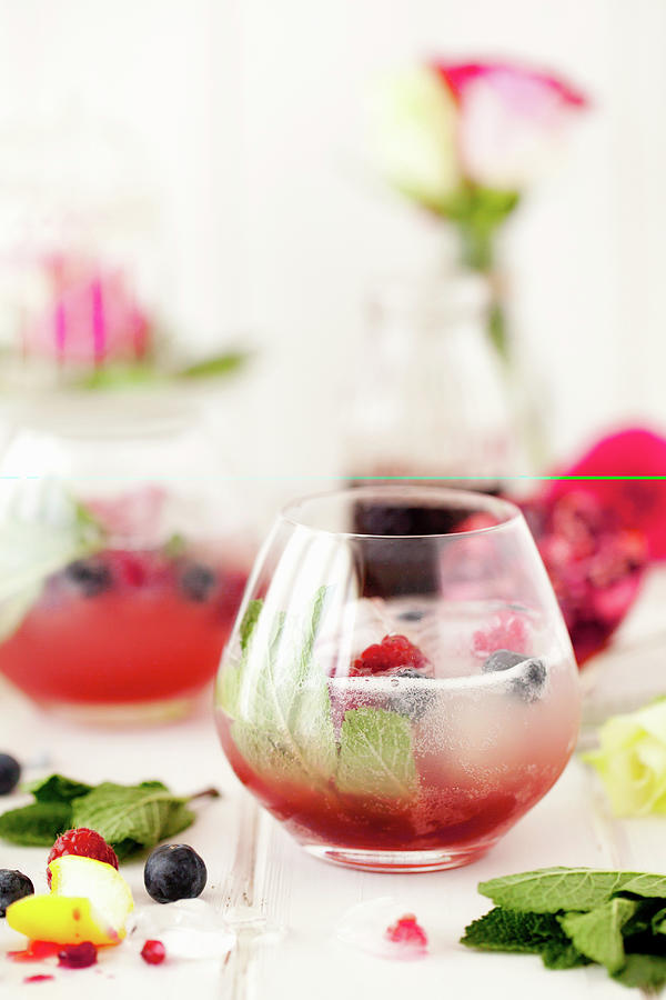 Grenadine Topped With Sparkling Cloudy Lemonade With Mint And Raspberries Photograph by Jane Saunders