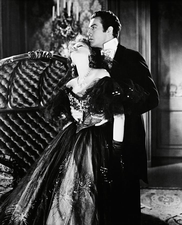 GRETA GARBO and ROBERT TAYLOR in CAMILLE -1936-. Photograph by Album
