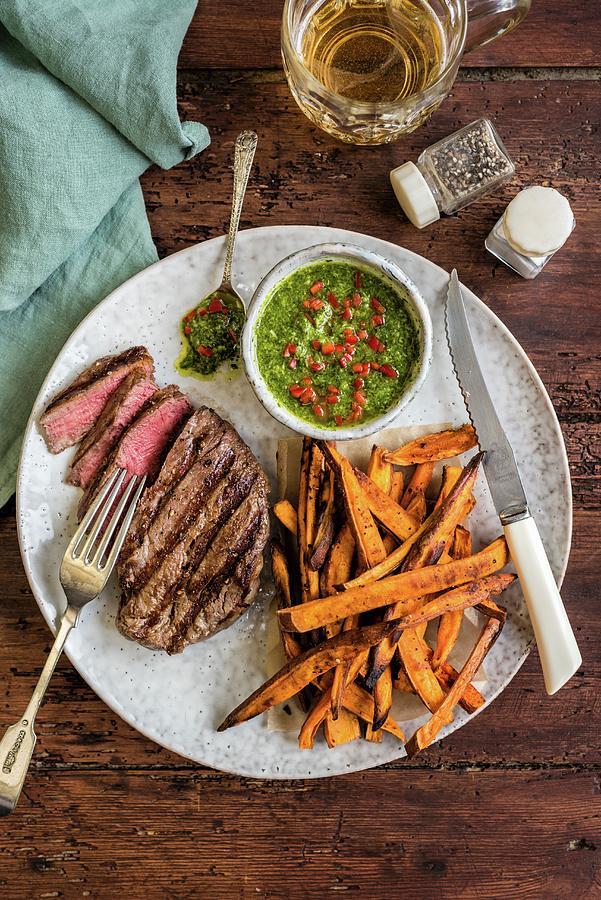 Griddled Fillet Steak With Sweet Potato Fries And Chimichurri Sauce Photograph by Lucy Parissi