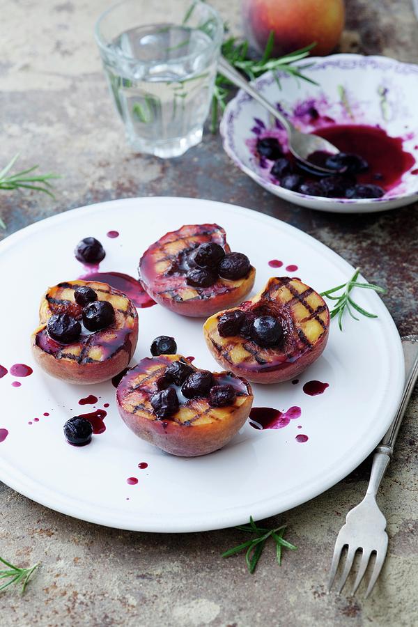 Griddled Peaches With A Blueberry Sauce Photograph by Victoria Firmston