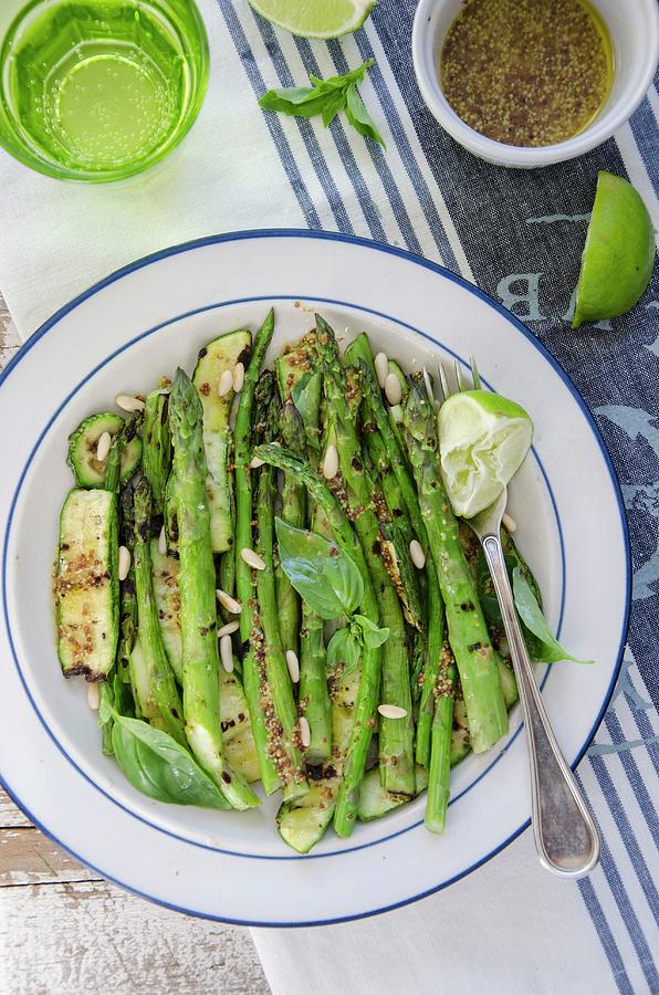 Grilled Asparagus And Courgettes With Pine Nuts And Mustard Dressing Photograph by Aniko Szabo