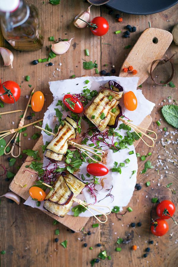 Grilled Aubergine With Tomatoes And Chives On A Cutting Board Photograph by Natalia Mantur