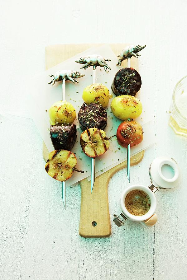 Grilled Black Pudding Skewers With Potatoes And Apples Photograph by Michael Wissing