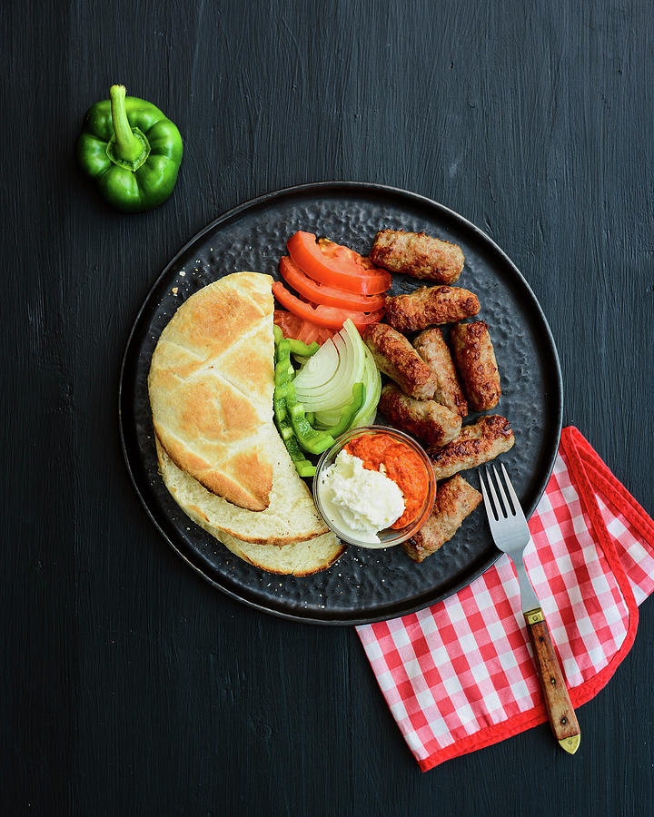 Grilled Cevapcici With Balkan Flatbread, Fresh Vegetables, Ayvar And ...