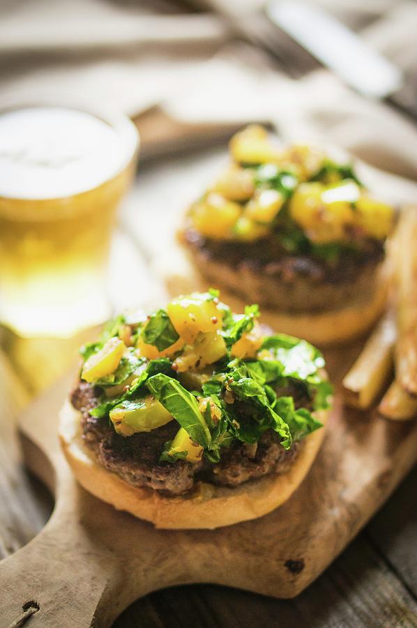 Grilled Cheeseburgers With Potatoes And Beer On A Chopping Board Photograph by Alena Haurylik