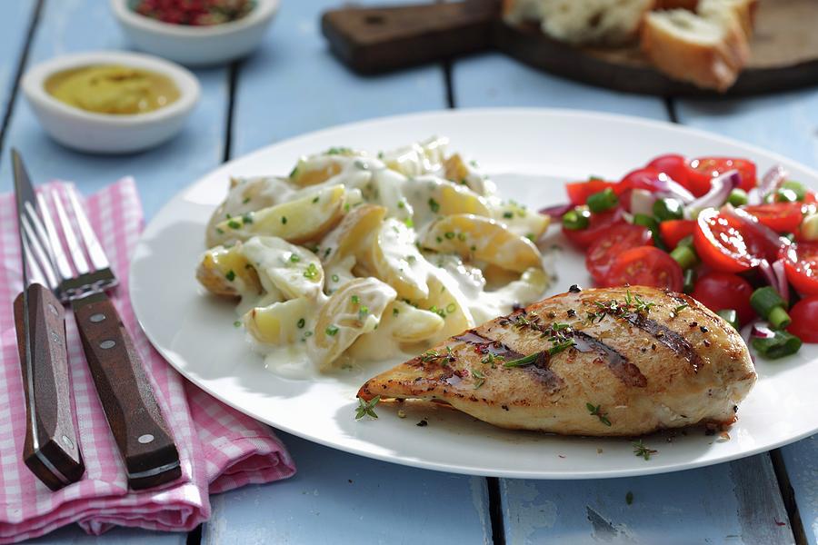Grilled Chicken Breast With Potato Salad And Tomato Salad Photograph by Frank Weymann