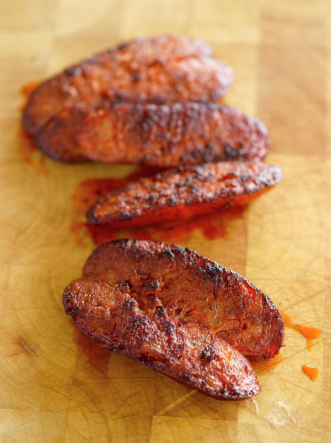 Grilled Chorizo, Sliced Photograph by Bill Kingston