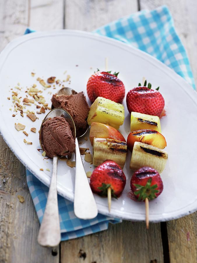 Grilled Fruit Skewers With Chocolate Ice Cream Photograph by Mikkel Adsbl