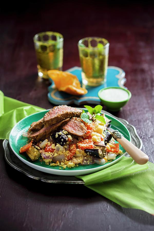 Grilled Lamb On A Bed Of Couscous With Fried Vegetables Photograph by Andrew Young