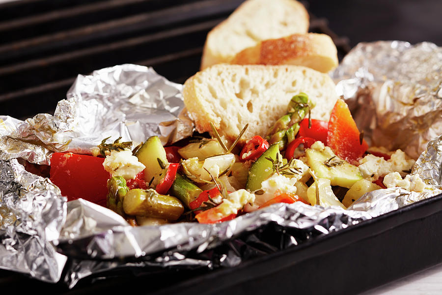 Grilled Mediterranean Vegetables With A Herb Marinade In Aluminium Foil With Sheeps Cheese And White Bread Photograph by Teubner Foodfoto