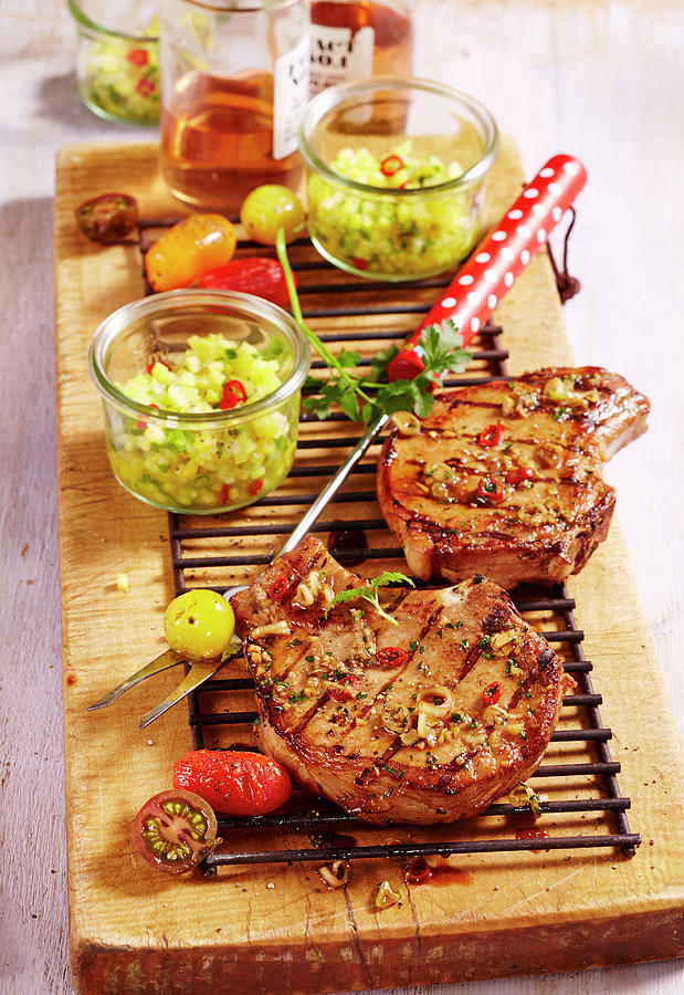 Grilled Oriental Marinated Pork Chops With A Pineapple And Cucumber Salsa Photograph by Teubner Foodfoto
