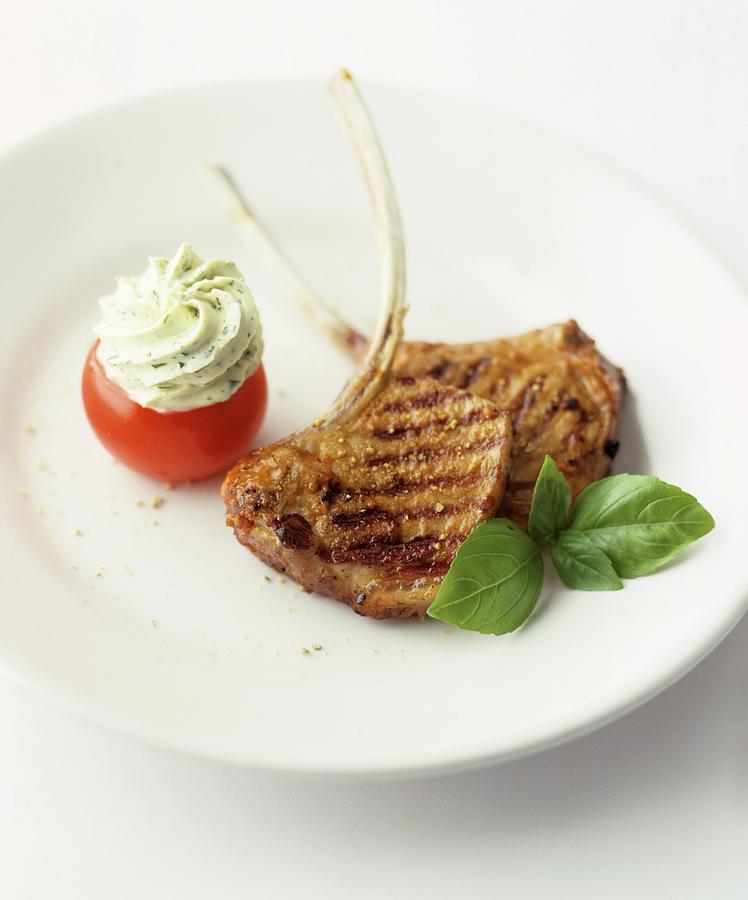 Grilled Pork Chops With A Stuffed Tomato Photograph by Michael Wissing