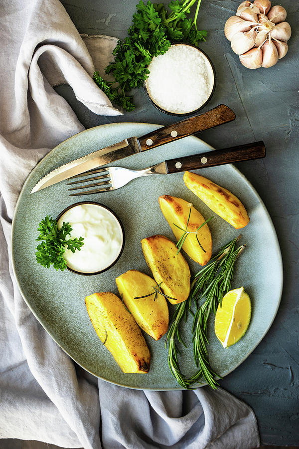 Grilled Potato With Rosemary And Creamsour Sauce On Stone Plate Photograph by Anna Bogush