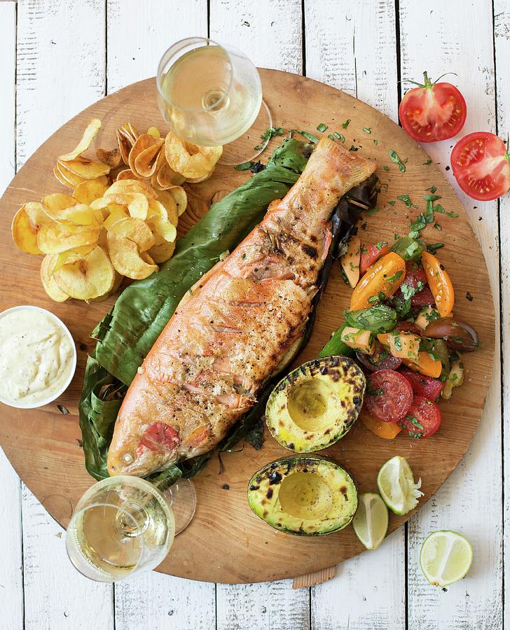 Grilled Rainbow Trout With Avocado, Tomato Salad And Potato Crisps Photograph by Sabine Steffens