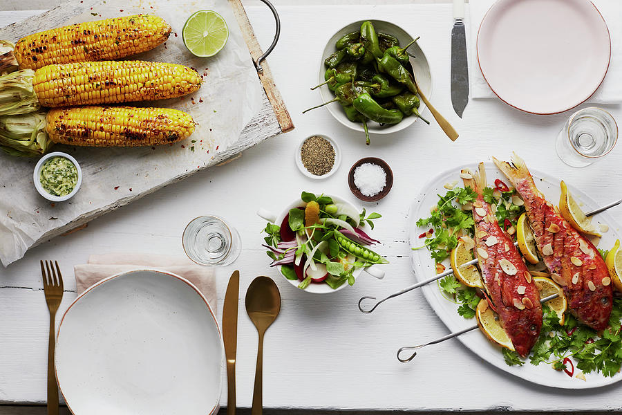 Grilled Red Snapper With Corn Cobs And A Vegetable Salad Photograph by Kathrin Mccrea