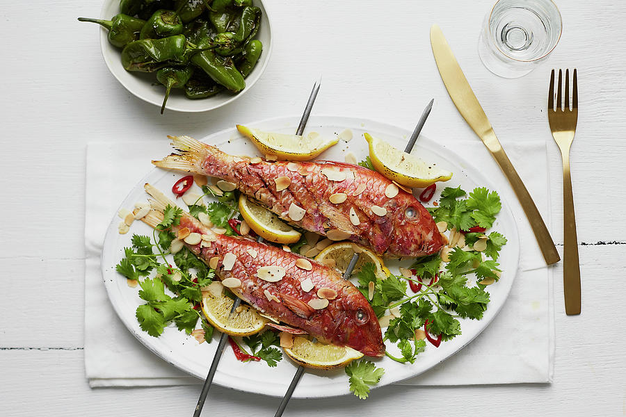Grilled Red Snapper With Lemons And Flaked Almonds On Skewers Photograph by Kathrin Mccrea
