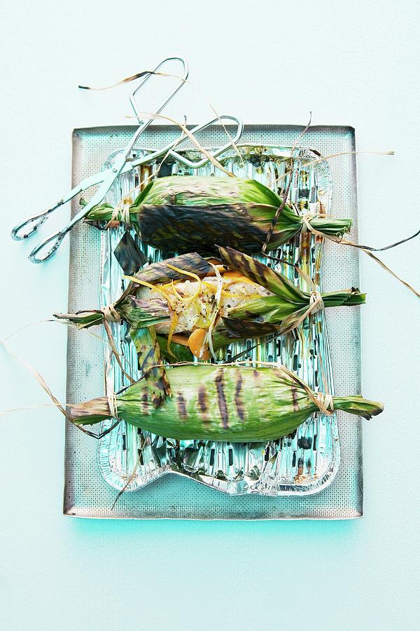 Grilled Salmon In Banana Leaves Photograph by Michael Wissing