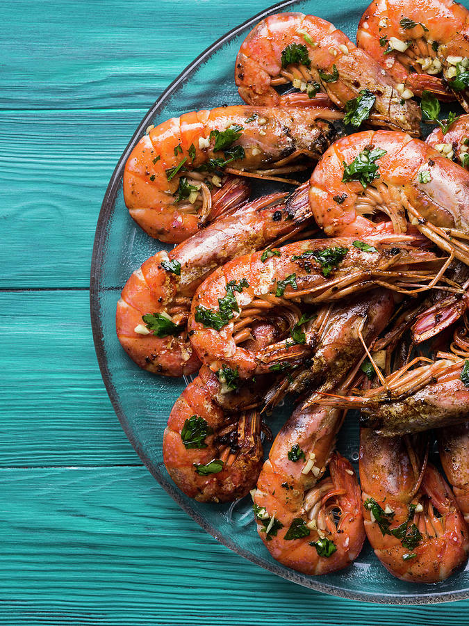 Grilled Shrimps Served On A Dish With Olive Oil, Parsley And Garlic Over Dark Green Wooden Background Photograph by Sofya Bolotina
