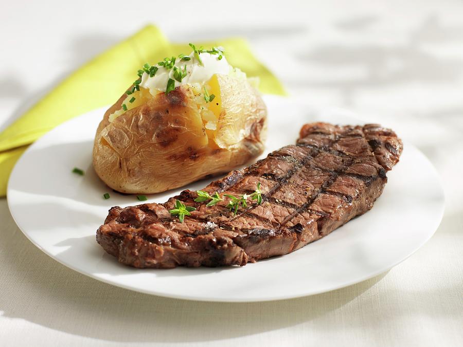 Grilled Steak With Baked Potato Photograph by Hall