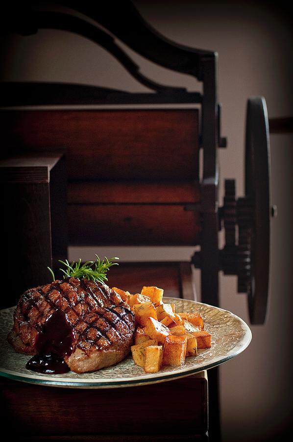Grilled Steak With Fried Potatoes And Barbecue Sauce Photograph by Tomasz Jakusz