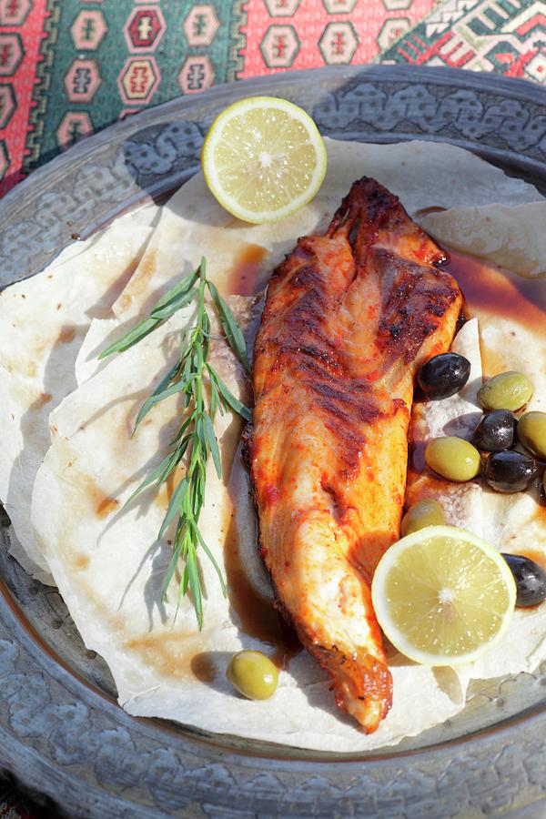 Grilled Sturgeon With Olives And Lemon Photograph by Barbara Lutterbeck