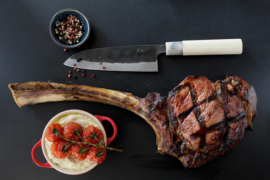Grilled Tomahawk Steak With Celery Puree And Tomatoes Photograph by Nicole Godt